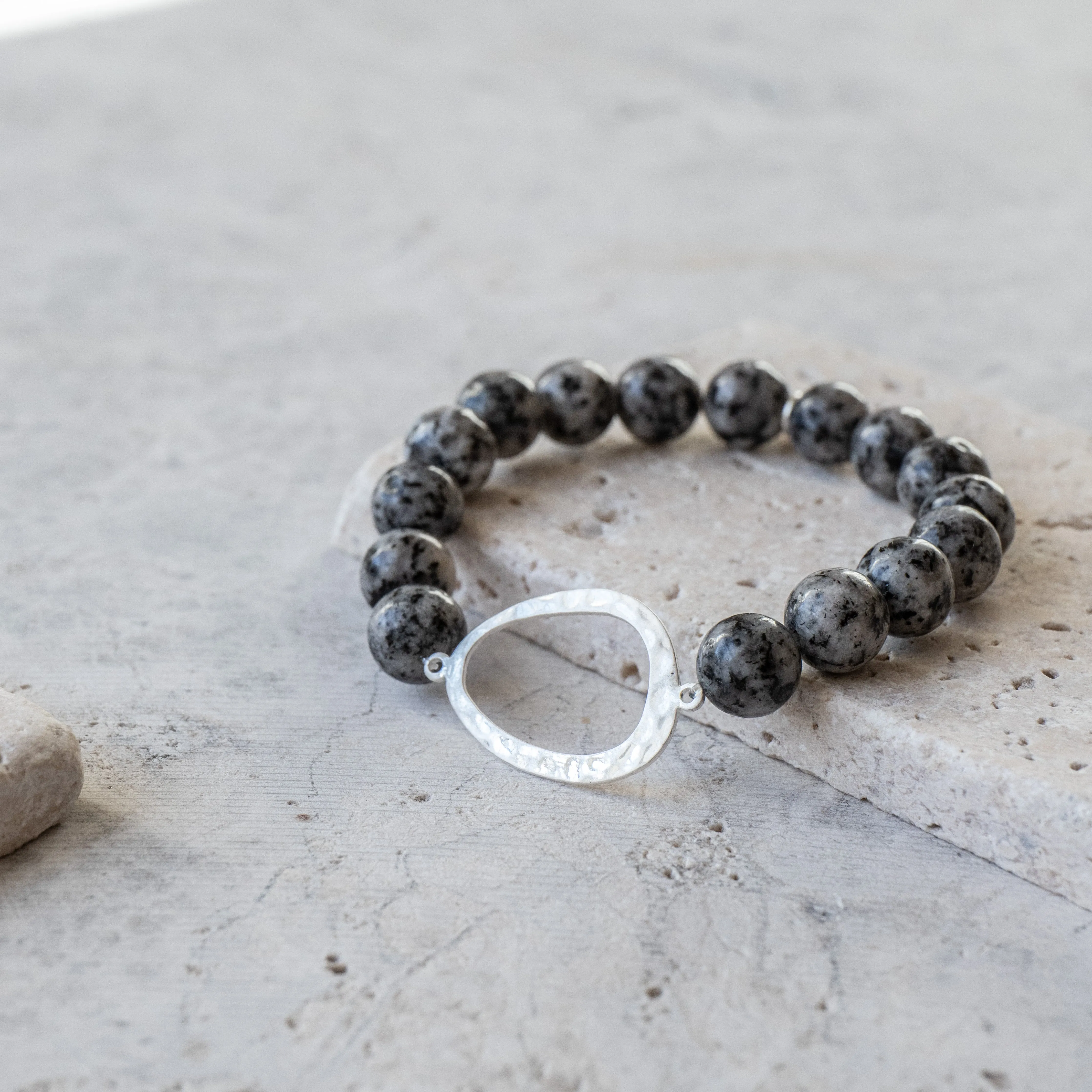 Oviod Captured Amidst Stone Beads Bracelet